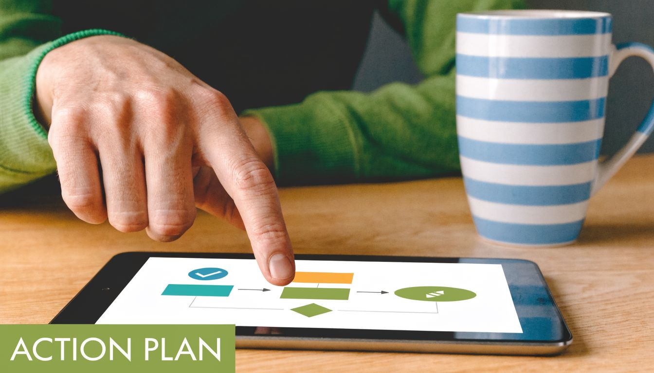 A person pointing at a digital flowchart on a tablet with a cup of coffee nearby.